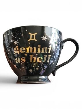 Claire's Gemini As Hell footed coffee mug featuring gold and silver star graphic